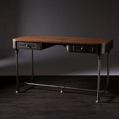 a wooden desk with two drawers on one side and a metal frame on the other