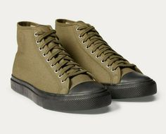 AUTHENTICITY GUARANTEED Style: RRL Sneaker Color: Olive Description: Inspired by a '30s military physical-training sneaker. Made from cotton canvas with a vulcanized rubber outsole. Constructed on a custom Double RL last. Fits true to size. Rounded toe. Lace-up front. Rubber toe cap. Padded canvas insole. Vulcanized rubber outsole. Rubber "RRL" tag at the heel. Cotton. Imported. Available in men's sizes from 5 to 13. We suggest women order two sizes smaller than their usual size. Please see the Khaki Canvas Sneakers With Rubber Sole, Khaki Lace-up High-top Sneakers With Rubber Sole, Canvas Shoes With Gum Sole For Sports, Khaki Sneakers With Vulcanized Sole For Streetwear, Khaki Sneakers For Streetwear With Vulcanized Sole, Khaki High-top Sneakers With Rubber Sole, Khaki Canvas Low-top Sneakers, Khaki Low-top Canvas Sneakers, Khaki Lace-up Canvas Sneakers