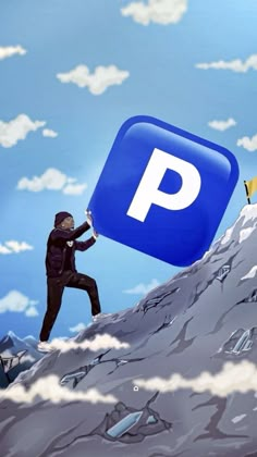 a man holding up a sign that says p on top of a mountain with other people