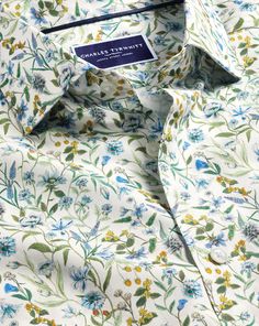 100% cotton, Available in classic and slim fit, Made with Liberty fabric, made in Italy, Exclusively designed for CT, Semi-spread collar, Rounded button cuff with one button, Classic and slim fit: back pleats, Machine washable - Made with Liberty Fabric Semi-Cutaway Collar Floral Print Shirt - Multi | Men's Charles Tyrwhitt Made With Liberty Fabric Semi-Cutaway Collar Floral Print Casual Shirt Size Large Cotton Fitted Cotton Dress Shirt With Casual Collar, Fitted Green Top With Spread Collar, Green Fitted Top With Spread Collar, Classic Fitted Collared Tops, Spring Dress Shirt With Spread Collar, Fitted Summer Dress Shirt With Placket, Classic Button-up Shirt With Floral Print, Classic Collared Tops With Floral Print, Classic Floral Print Button-up Shirt