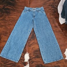 Levi Wide Leg Jeans. Size W27xl31. Never Worn. Levi's Blue Wide Leg Jeans, Levi's Blue Wide-leg Jeans, Levi's Blue Wide Leg Bottoms, Levis Wide Leg Jeans, Style Wide Leg Jeans, High Rise Bootcut Jeans, Cropped Wide Leg Jeans, Cropped Flare Jeans, Raw Hem Jeans