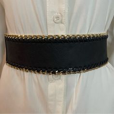 Black Faux Leather Elastic Waistband Gold Tone Braided Chain Belt Color: Black, Gold Tone Material: 50% Faux Leather, 50% Elastic Please Notice: White Shirt Is Not Included, Listing Is For The Belt Only. Warning: P65 (See Last Picture) All Measurements Are Approximate And Taken Laying Flat: Length: 29 Inches Width: 2 1/2 Inches Tags For Exposure: Chunky Black Gold Black Belt Waist Belt Western Wide Location: Tote: #2 Trendy Black Chain Belt With Chain Strap, Edgy Black Chain Belt With Adjustable Chain, Adjustable Black Metal Chain Belt, Edgy Black Adjustable Chain Belt, Chic Black Chain Link Belt, Chic Black Adjustable Chain Belt, Adjustable Black Chain Belt With Chain Strap, Chic Metal Chain Belt For Night Out, Adjustable Black Chain Belt