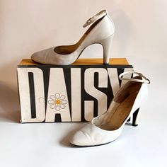 "Vintage 70's / 80's off white leather high heels  With original box  Marked Women's size 6.5 M Ankle buckle stiletto pumps with pointed toes Made by Daisy Length on insole : 9.25\" Width at ball : 2.5\" Height : 6.5\" Heel height : 3.5\"" Stiletto Shoes, Leather High Heels, Stiletto Pumps, Womens High Heels, Womens Heels, Vintage 70s, White Leather, Vintage Ladies, Original Box