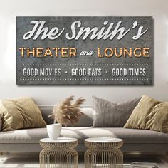 the smith's theater and lounge sign is displayed in front of a couch with pillows