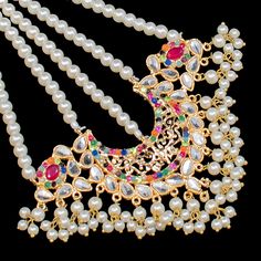 An exquisite set that draws attention with its echoes of traditional motifs. Alluringly timeless set enhanced with nauratan stones. Approximate mala length is 15". The set includes a choker paired with a mala, a matching maang teekah and a jhoomar and a pair of matching earrings. Approximate earrings length is 4.5". Gold-plated on high-quality brass as base metal. Made by order. Kindly allow 4-6 weeks for the delivery of this item. For custom or urgent requests, please contact support@alacouture Navratri Kundan Jewelry With Motifs, Kundan Jewelry With Motifs For Navratri, Traditional Jewelry Sets With Motifs For Festive Season, Traditional Festive Jewelry Sets With Motifs, Hand Set Bollywood Jewelry For Rituals, Traditional Jewelry With Motifs For Navratri, Traditional Tilla Jewelry For Festivities, Traditional Festive Jewelry With Tilla, Ceremonial Kundan Tikka With Motifs