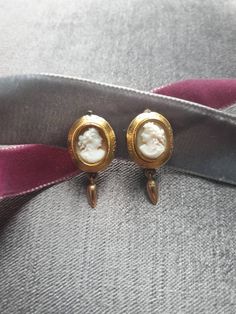 Lovely pair of antique Victorian hand carved shell cameo clip on earrings depicting lady's head profile, cameo set in yellow gold tested 585 ct. Cameo in decorative gold frame from the late 1800. Clip mechanism is of later addition, yellow gold stamped 333 ct. Measurments: 2 x 1.5 cm. Weight  6.0 g. Victorian Clip On Earrings, Victorian Cameo Yellow Gold Earrings, Formal Cameo Yellow Gold Earrings, Formal Yellow Gold Cameo Earrings, Victorian Cameo Earrings For Formal Occasions, Victorian Antique Gold Earrings For Formal Occasions, Antique Gold Victorian Earrings For Formal Events, Antique Gold Victorian Earrings For Formal Occasions, Victorian Gold Cabochon Earrings