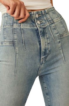 Retro-inspired flares and flattering pleats add dimension to a pair of scene-stealing jeans finished with a high rise and a hint of stretch. 33 1/2" inseam; 23" leg opening; 12 1/2" front rise; 16" back rise (size 29) 91% cotton, 7% polyester, 2% elastane Dry clean or machine wash, tumble dry Imported Retro Inspired, Flare Jeans, Top Brands, Free People, High Rise, Dry Clean, Nordstrom, Wardrobe, Luxury Fashion