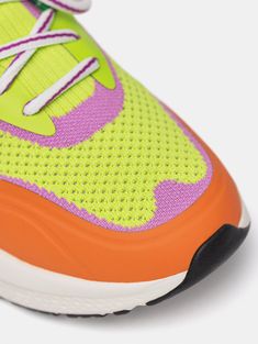 Style and functionality merge in SWIFT. These running-style sneakers in lime green with hints of lilac, an orange rubber toe cap, and a green heel, are the perfect complement for days when comfort with a casual and sporty touch is key. Crafted with technical flyknit material and OrthoLite insoles, they ensure lightness, cushioning, and support. The embossed logo adds a distinctive touch. Their elastic design makes them easy to slip on and off, perfect for wearing sock-free. Sole height: 4.5 cm Green Slip-on Sneakers For Sports With Rubber Sole, Green Breathable Low-top Slip-on Sneakers, Multicolor Breathable Sporty High-top Sneakers, Sporty Multicolor Breathable High-top Sneakers, Sporty Neon Low-top Sneakers, Breathable Green High-top Sneakers For Light Sports, Breathable Mesh Orange Sneakers, Multicolor Casual High-top Sneakers For Running, Green High-top Sneakers For Light Sports