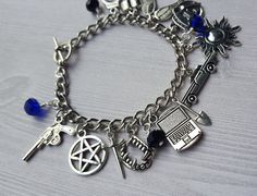 Supernatural Charm Bracelet by AlwaysBelieveJewelry on Etsy Personalized Black Metal Charm Bracelet, Silver Novelty Charm Bracelet, Nickel Free Black Metal Charm Bracelet, Silver Novelty Metal Charm Bracelet, Novelty Silver Metal Charm Bracelet, Nickel-free Black Metal Charm Bracelet, Novelty Silver Hypoallergenic Charm Bracelet, Themed Nickel-free Stainless Steel Jewelry, Nickel-free Themed Stainless Steel Jewelry