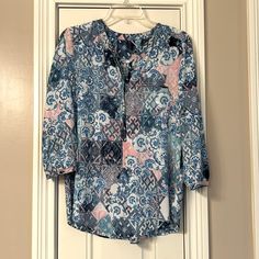 Henley Blouse With Half Button Front. This Blouse Is New Condition Without Tags. Blue And White With Some Pink Mixed In. 3/4 Sleeves Have Button Fastener. 20.5” Pit To Pit. Pin Tucks, Blouse Top, Sleeve Blouse, Blue White, Color Blue, Top Blouse, Blue And White, Womens Tops, Tags