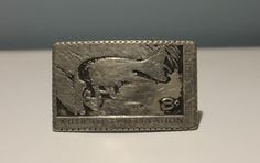 "Vintage, United States Wildlife Conservation, 8 cent stamp, solid pewter silver belt buckle. Well worn appearance. In fair condition. 3\" x 2\"" Vintage Silver Stamped Belt Buckles, Vintage Silver Belt Buckles For Western-themed Events, Luxury Vintage Silver Belt Buckles, Vintage Engraved Antique Silver Belt Buckles, Vintage Silver Engraved Belt Buckle, Vintage Silver Rectangular Belt Buckles, Antique Silver Belt Buckles For Collectibles, Antique Silver Belt Buckles Collectible, Antique Silver Collectible Belt Buckles