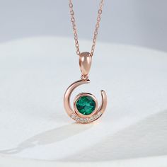 This moon-shaped pendant necklace is a necklace that coexists with romance and elegance. The round emerald stone on the necklace is located in the center of the moon, which adds vitality to it, and the outer edge of the moon is set with small white sapphires, making the entire pendant even more sparkling.   Stone Type: Lab Emerald & White Sapphire  Carat Total Weight: 0.78ct   Style: Dainty  Chain Length: 16" with 2" extender (40+5cm)  Clasp Type: Lobster   Metal Material: Available for Gold Elegant Round Pendant Emerald Necklace, Elegant Emerald Necklace With Round Pendant, Elegant Crescent Shaped Birthstone Jewelry, Elegant Crescent Birthstone Jewelry, Formal Emerald Necklace With Round Pendant, Emerald Necklace For Anniversary, Round Emerald Necklace For Anniversary, Emerald Necklace With Round Pendant For Anniversary, Emerald Necklace With Round Pendant For May Anniversary