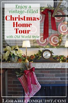 an old world style fireplace decorated for christmas with red ribbon and stockings hanging from the mantel