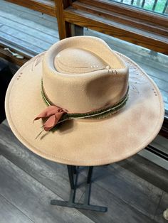 Discover the rugged charm of our Burned Western Hat. This unique, handcrafted cowboy hat features a distressed look, giving it a vintage, well-worn appeal perfect for Western enthusiasts and fashion-forward individuals. Features: Handcrafted Design: Each hat is meticulously burned and distressed to achieve a one-of-a-kind look. Premium Materials: Made from high-quality materials for durability and comfort. Unique Aesthetic: The burned finish adds a distinctive vintage style that sets it apart. B Country Style Brimmed Felt Hat For Kentucky Derby, Country Style Wide Brim Felt Hat For Kentucky Derby, Country Style Beige Felt Hat For Rodeo, Beige Country Style Felt Hat For Rodeo, Rustic Fedora Felt Hat For Ranch, Rustic Adjustable Felt Hat For Kentucky Derby, Beige Western Felt Hat For Kentucky Derby, Rustic Fedora Hat For Kentucky Derby, Rustic Brimmed Felt Hat For Kentucky Derby