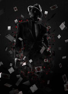 a man in a suit and hat surrounded by playing cards on black background with red dots