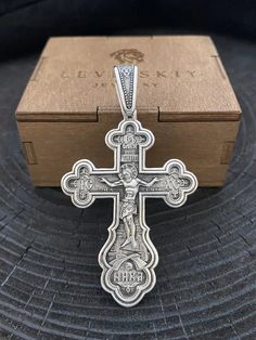 "Silver double-sided cross \"Crucifixion of Christ. Prayer to the Cross. Orthodox cross\" ✔️Silver 925 with blackening ✔️Weight 17 grams (+- 1 gram) ✔️Size 71/43 mm (including eyelet) 58/43 mm (excluding lug) ✔️Possible production in: 🟡Gold 14K or 18K (red, yellow, white) 🌕24K gold plated sterling silver 🔘Silver with blackening or rhodium Need more information? If you have any questions please don't hesitate to contact us!" Silver Symbolic Crucifix Jewelry And Charms, Silver Symbolic Cross Necklace As Gift, Engraved White Gold Cross Charms, Hallmarked Silver Cross Pendant, Silver Hallmarked Cross Pendant, The Crucifixion, Orthodox Cross, Gold Plated Sterling Silver, Silver Chain