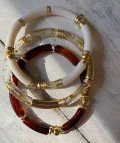 Set of 3 bracelets- gorgeous combination of ivory / tortoise and gold speckled with gold accents throughout Sizes small 6.5 Medium 7 Large 7.5 Extra large 8 This bracelet runs small- if you like it to be a looser fit order a half size up! Majestic Accessories, Tortoise Shell Jewelry, Gold Bangle Bracelets, Tube Bead Bracelet, Acrylic Bracelet, Acrylic Tube, Bracelets Patterns, Jewelry Design Inspiration, Diy Bracelets Patterns