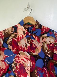 Vintage Cacharel Floral Silk Blouse! So cute! Long sleeves, a classic collar, and buttons up the front. Would best fit a size small, please refer to measurements. In overall great vintage condition with minor signs of wear on the arm pits. Approx. Measurements: Underarm to Underarm: 19" Sleeve Length: 24.5" Length: 23.5" Retro Office Blouse With Button Closure, Retro Collared Blouse For Work, Retro Button-up Blouse With Vintage Print, Vintage Multicolor Blouse For Daywear, Vintage Style Multicolor Blouse For Daywear, Multicolor Vintage Blouse For Daywear, Vintage Collared Formal Shirt, Retro Workwear Blouse With Peter Pan Collar, Fitted Floral Print Blouse With Spread Collar