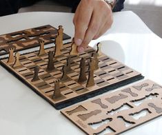 a person playing a game of chess on a table