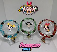 Handmade Powerpuff girls bracelets 🌟 ~ beaded by me, please handle with care. ~Extremely durable (All bracelets are double banded) ~Perfect gift for friends 🫶🏾 ~ more on my instagram @braceletsbychi Green Novelty Bracelets With Round Beads, Themed Beaded Bracelets With Round Beads As Gift, Handmade Themed Bracelet With Round Beads, Themed Green Beaded Bracelets For Gifts, Themed Green Beaded Bracelets As Gift, Green Themed Beaded Bracelets As Gifts, Cartoon Bracelet, Girls Bracelets, Bracelets Matching