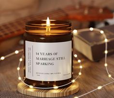 9 OZ 14 Years Of Marriage Still Sparking - 14 Year Anniversary Gift For Him Celebrate 14 incredible years with a gift that's as timeless as your love and as bright as your connection! Our "14 Years Of Marriage Still Sparking" candle is the perfect way to honor your journey together with humor and warmth. Designed for the husband who still lights your fire, this candle offers a touch of wit and sentiment that will make him smile. Key Features: - Scented (5 scents), creating a cozy atmosphere perfect for romantic nights. Features a playful message: "14 Years Of Marriage Still Sparking" - because after all these years, the spark is still alive! - A perfect keepsake that blends humor, love, and a practical touch for everyday use. Whether you're gifting it as a standalone present or pairing it Marriage Stills, Romantic Nights, Anniversary Candle, Romantic Gifts For Him, Funny Anniversary, Anniversary Gift For Him, Anniversary Funny, Romantic Gestures, Year Anniversary Gifts