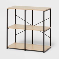 three wooden shelves with black metal frames on each shelf, one is empty and the other has