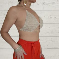 Introducing the Two-Way Crochet Cropped Top from Rita Rosa Brazilian Beachwear. Handcrafted with passion, this top embodies the elegance and versatility of sustainable fashion. Available in earthy beige and vibrant red, it flatters your shape and accentuates your style. Each piece is meticulously handmade, ensuring uniqueness. It features eco-friendly materials, padded cups for comfort and support, a fashionable halter neckline, and delicate lace straps. The innovative two-way design allows vers Beige V-neck Top For Festival, Bohemian Beach Top In Natural Color, Beige V-neck Tops For Festivals, Beige Triangle Crochet Top For Summer, Beige Stretch Crochet Lace Top, Chic Fitted Crochet Top For Festival, Beige Triangle Top For The Beach, Beige Crochet Lace Top For Beach Season, Beige Open Knit Crop Top For Summer