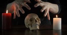 Spells over the skull. Tense female hands over the skull and burning candles at night. Candle In The Dark, Break Up Spells, Spells For Beginners, Black Magic Removal, Black Magic Spells, Bring Back Lost Lover, Spell Cast, Powerful Love Spells, Love Spell Caster