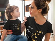 Inspire the next generation with our Mommy and Me T-Shirt Set: "Hope, Dream, Inspire". This coordinating set is perfect for mothers and their little ones who believe in the power of big dreams and even bigger hearts. The adult tee proudly reads "Hope, Dream, Inspire," representing the nurturing guidance of a parent, while the child's shirt reads "Hopeful, Dreamy, Inspired" the sentiment, showing how they are learning to follow their dreams and spread hope wherever they go. Product features - Made with 100% Airlume combed and ring-spun cotton for breathability and comfort - Retail fit for casual and semi-formal settings, perfect for layering - Manufactured by Bella+Canvas in a humane, sustainable way - Ribbed knit collar with seam for elasticity and shape retention - Tear-away label for min Mommy And Me Shirts Daughters, Mom Daughter Matching Tshirts, Mom And Mini Me Shirts, Mama And 2 Daughters Shirts, Mommy And Mini Shirt, Matching T Shirts, Mom And Me, Cute Matching, Matching Mom