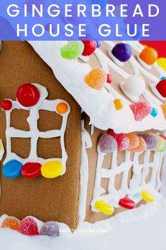 a gingerbread house with candy on top and the words, how to make a gingerbread house glue