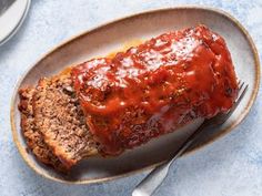 meatloaf on a plate with a knife and fork