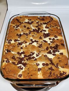 a casserole dish with cookies and cream in it on a stove top oven