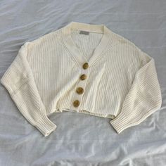 Urban Outfitters Knit Cardigan Size Small Condition: Nwot Color: Ivory Details : - Button-Down - Perfect On Its Own Or For Layering Extra: - I Ship Between 1-2 Days White Knitted Button-up Outerwear, White V-neck Sweater With Buttons, Beige Cotton Sweater With Buttons, Cream Knit Button-up Cardigan, Cream Button-up Knit Sweater, Cream Knit Button-up Sweater, Cream V-neck Sweater With Buttons, Cozy White Button-up Cardigan, Cream V-neck Cardigan With Buttons