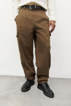 Information The Wes Pants are cargo pants made from a heavy-weight cotton fabric with essential side and back welt pockets. The semi-baggy silhouette and ankle length ensure a comfortable and proportional fit. Details 100% Cotton Relaxed Fit Utility Pockets Adjustable Drawstrings Malachi is 6'0" and wearing a size LMeasurements: 39" Chest, 29" WaistStyle #PA167 Utility Pockets, Fit Details, Welt Pockets, Heavy Weight, Welt Pocket, Cargo Pants, Ankle Length, Cotton Fabric, Relaxed Fit