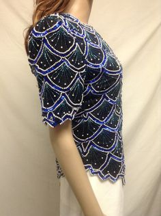 "Beaded Sequin Top, Blue ,Green, White, Formal top,medium,Large Zipper and hook clasp close. Lined Measurements: Bust 35\" waist 34\" Hips 39\" Excellent Condition No size or maker tag but I had one exactly like this that said Laurence Kazar on it Free shipping in the US NK248F4 Beaded Sequin Top, Blue ,Green, White, Formal top,medium,Large" Blue Short Sleeve Blouse For Night Out, Fitted Blue Embellished Blouse, Beaded Short Sleeve Tops For Evening, Blue Embellished Party Blouse, Fitted Beaded Short Sleeve Tops, Blue Sequined Blouse For Spring, Elegant Blue Embellished Top, Blue Short Sleeve Top For Night Out, Blue Embellished Short Sleeve Top