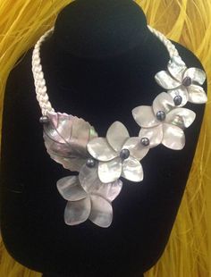 "This shell necklace is beautiful for a mothers day gift, wear it with your nice dress, or for tahitian and polynesian dance costume. OPTIONS- Black, Beige Cord. We can make this necklace to any length you like, please let us know. NOTE-- All items are natural, no two items are the same. There will be slight differences in size, shape, coloring and pattern. All sizes are approximate.. Mesurement--Please let us know how long you want the cord. The length on the picture is a 19\" long. This listin Unique Flower-shaped Beach Jewelry, Unique Flower Jewelry For Beach, Elegant Flower Necklace For Beach, Elegant Handmade Jewelry For Beach Wedding, Handmade Shell Necklace For Wedding, Polynesian Outfits, Tahitian Jewelry, Scales Art, Fresh Water Pearls Necklace