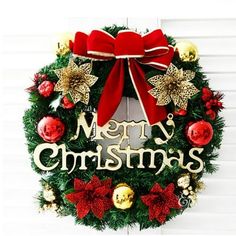 a christmas wreath with the words merry christmas on it and decorations in gold, red and green