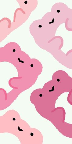 pink and black donuts on a white background that looks like they're smiling