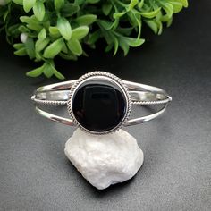 Classic Black Cuff Bracelet Bangle, Classic Black Cuff Bracelet In Bangle Style, Formal Black Cuff Bracelet With Polished Finish, Black Polished Cuff Bracelet For Formal Occasions, Black Cuff Bracelets For Formal Occasions, Formal Black Polished Cuff Bracelet, Polished Black Bracelets, Classic Black Bangle As Gift, Adjustable Black Cuff Bracelet With Polished Finish