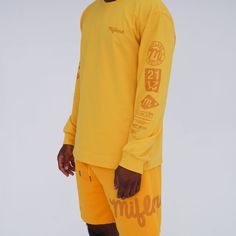 Antique Yellow/Yellow The collection features graphic heavy heavyweight mesh shorts and a 6.5 ounce Long sleeve shirt. The long sleeve shirt features graphic heavy sleeves taking cues from sponsorship jerseys used in sports. True To Size Regular Fit * Shirt & Shorts Different Hues of Yellow (Mix-Match) Sporty Long Sleeve Jersey For Sports Season, Sporty Long Sleeve Jersey With Letter Print, Sporty Yellow Long Sleeve T-shirt, Yellow Tops With Screen Print For Sports, Long Sleeve Athleisure T-shirt For Streetwear, Long Sleeve Graphic Print Sportswear T-shirt, Cotton Jersey For Sports Season Streetwear, Cotton Jersey For Streetwear During Sports Season, Sporty Long Sleeve Jersey For Streetwear