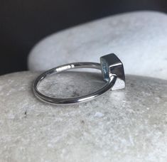 A Teeny square-shaped genuine Swiss Blue Topaz handcrafted in sterling silver, makes a great birthstone ring for those December Birthday gals or a great stackable ring or pinky/thumb/midi ring as it is small stone! Wrapped in a box ready for gift giving.(r-new-1)Blue Topaz measures 6mm*LIKE* us on Facebook http://www.facebook.com/Belesas to get 10%off coupon code,*FOLLOW* us on Twitter https://twitter.com/#!/Belesas to get more exclusive coupon codes*All item are ready to ship! Free shipping on Sterling Silver Emerald Ring With Square Cut As Gift, Minimalist Stackable Rings With Rectangular Stone, Square Cut Emerald Ring In Sterling Silver, Minimalist Open Topaz Ring, Minimalist Emerald Cut Birthstone Ring, Minimalist Sterling Silver Emerald Ring For Gift, Minimalist Square Cut Gemstone Ring, Minimalist Rectangular Birthstone Rings, Minimalist Everyday Topaz Ring