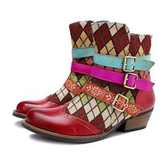 Make an artistic style statement in this durable leather ankle boot embellished with a crisscross buckle strap at the ankle and a vibrant mix of patterns and colors. 2'' heel 10.2 Shaft Zip closure Leather upper Leather lining Rubber sole Vintage Multicolor Boots For Fall, Bohemian Moto Boots For Festival In Fall, Retro Multicolor Boots For Fall, Multicolor Retro Boots For Fall, Bohemian Moto Boots With Round Toe, Retro Multicolor Boots For Winter, Multicolor Leather Moto Boots For Fall, Bohemian Moto Boots With Round Toe For Fall, Multicolor Ankle-high Boots For Fall