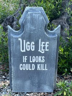 a cement tombstone with the words ugg lee if looks could kill