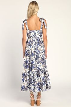 Capture that vacay vibe no matter where you are in the Lulus Mallorca Memories White Floral Print Tiered Tie-Strap Maxi Dress! Midweight woven fabric boasts a vintage-inspired floral print as it shapes tying shoulder straps that support a princess-seamed bodice with a fitted waist. Tiered skirt falls to a maxi hem. Hidden zipper/clasp at side. Fit: This garment fits true to size. Length: Ankle length. Size medium measures 44.5" from adjustable straps to hem. Bust: Great for any cup size. Waist: Vacation Maxi Dress With Adjustable Straps And Square Neck, Tiered Sundress With Tie Straps, Vintage Spaghetti Strap Dress For Vacation, Vintage Spaghetti Strap Vacation Dress, Feminine Tie-straps Maxi Dress For Beach, White A-line Sundress With Tie Straps, Floral Maxi Tie-strap Dress, Tiered Tie-back Beach Midi Dress, Maxi Dress Floral