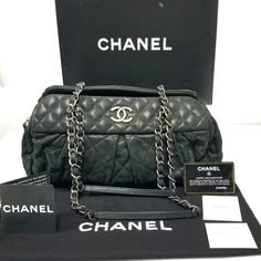 A Chanel Black Iridescent Calfskin Chic Quilted Bowling Style Handbag. This Is A Super Cute Piece From Chanel. The Bowling Bag Style Is Highly Versatile And Easy To Use. Created In Iridescent Calfskin This Bag Will Add A Sparkle To All Your Classic And Creative Looks, Day Or Night. Finished Beautifully With Gunmetal Silver Hardware. Condition: Excellent, Sparingly Used. Designer = Chanel Colour = Black Material = Iridescent Calfskin Style = Chic Quilt Bowling Category = Shoulder Bags Dimensions Evening Shoulder Bag With Silver-tone Logo, Evening Leather Bag With Silver-tone Logo Plaque, Modern Party Bags With Silver-tone Logo Plaque, Luxury Formal Shoulder Bag With Silver-tone Logo Plaque, Luxury Rectangular Bag With Silver-tone Logo Plaque, Luxury Shoulder Bag With Silver-tone Logo Plaque, Luxury Black Shoulder Bag With Silver-tone Logo, Designer Bags With Silver-tone Logo Plaque For Formal Events, Designer Black Shoulder Bag With Silver-tone Logo