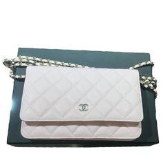 This authentic CHANEL Classic Quilted Light Pink Caviar Leather Wallet on Chain is the perfect addition to any fashion-forward women's collection. The wallet features a quilted pattern with a magnetic closure and a chain strap, making it a versatile accessory that can be worn as a wallet or a small crossbody bag. It is made of high-quality calfskin leather with a light pink exterior color and a classic CHANEL design. The CHANEL Caviar Classic Wallet on Chain comes with original accessories, including the box and dust bag. It has several features, such as credit card slots, making it a practical and stylish accessory for everyday use. Whether you are running errands or going out for a night on the town, this wallet on chain is the perfect accessory to complete your look. Sold as is. Great c Classic Chanel, Chanel Design, Quilted Pattern, Wallet On Chain, Chanel Caviar, Small Crossbody Bag, Small Crossbody, Stylish Accessories, Magnetic Closure