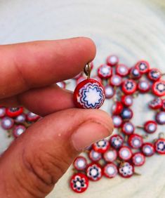 These fun glass beads are hand made and ready to be created into a beautiful work of art. Perfect for jewelry or any creative project! Set of 50 Traditional Heart Beads For Jewelry Making, Handmade Oval Glass Beads, Handmade Red Craft Supplies, Handmade Red Craft Supplies For Gifts, Artisan Colorful Beads For Jewelry Making, Artisan Beads For Jewelry Making, Artisan Spacer Beads For Jewelry Making, Heart Shaped Beads For Crafts And Gifts, Artisan Spacer Beads For Crafting