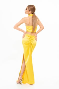 The Exclusive Sunset Crop Top provides a modern refresh to your summer edits. This stylish and innovative piece is made from a double layered stretch satin fabric. Wear it to shape a halter-neckline. Open back zip fastening. Colour: Yellow Composition: Stretch Satin Summer Stretch Satin Halter Top, Stretch Satin Halter Top For Summer, Fitted Elastane Crop Top For Party, Stretch Satin Halter Top For Party, Stretch Satin Halter Neck Top, Satin Halter Neck Top For Night Out, Fitted Ruched Bandeau Halter Top, Party Satin Stretch Halter Top, Satin Tie Back Halter Top For Evening