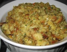 a white bowl filled with food on top of a stove