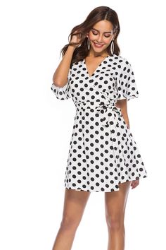 This adorable a-line mini dress is both sassy and sweet. Featuring a wrap front with cinched waist and sash belt and plunging v-neckline. This dress falls mid-thigh and pairs perfectly with wedges, heels or sandals. Made with a polyester and spandex blend for comfort and style. Chic V-neck Wrap Dress For Day Out, Belted V-neck Mini Dress For Day Out, Belted V-neck Mini Dress For Summer, Belted V-neck Summer Dress, Flirty Belted Summer Dress, Flirty Mini Wrap Dress With Tie Waist, Summer Mini Length Belted Dress, Flirty Mini Length Wrap Dress With Tie Waist, Belted Mini Dress For Beach